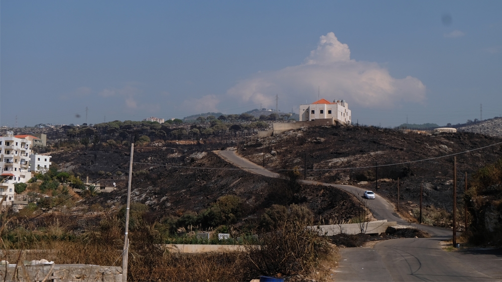 Scorched earth surrounds a police station on the outskirts of Damour in Chouf. Some pine trees survived the fierce fires that rolled down from the mountains behind the coastal town