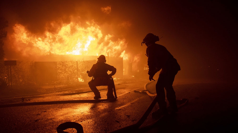 Firefighters tried to save homes after a fire broke out near Los Angeles.