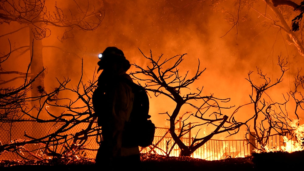 Winds out of the north were driving the fire as firefighters struggled to save homes