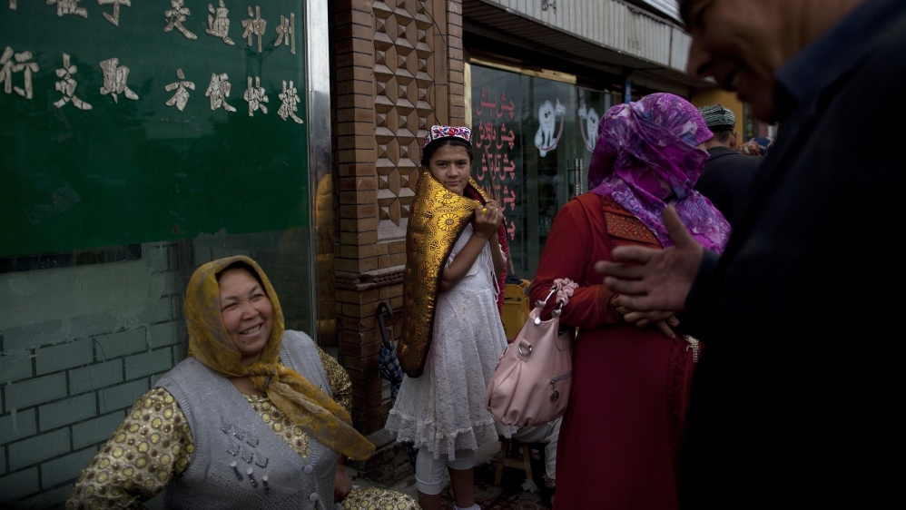 Exiled Uighurs and rights defenders say China is trying to erase Uighur culture and identity