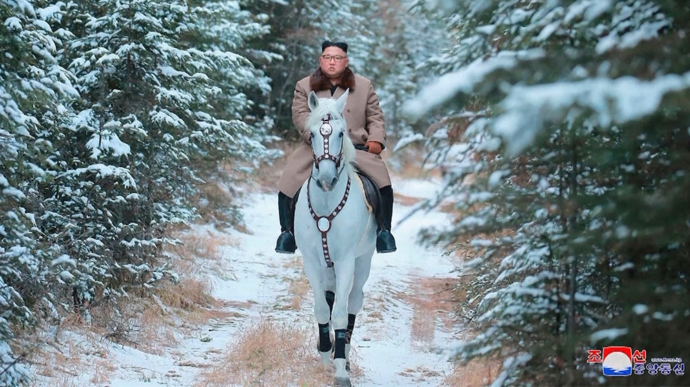 Kim Jong Un rides through snow-covered landscapes on Mount Paektu. Experts say such photos are released to show him as a man powerful enough to bring prosperity to his country without anyone else’s help [KCNA via AP Photo]