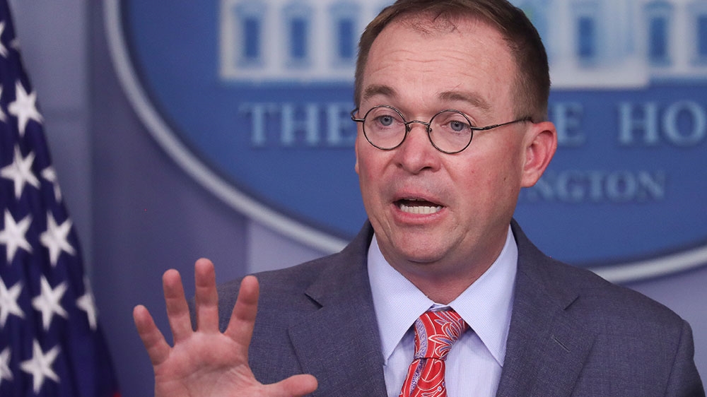 Acting White House Chief of Staff Mick Mulvaney answers questions from reporters during a news briefing at the White House in Washington, DC