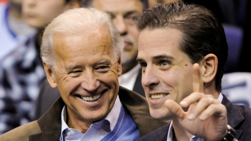Joe Biden and his son Hunter Biden attend an NCAA basketball game between Georgetown University and Duke University in Washington