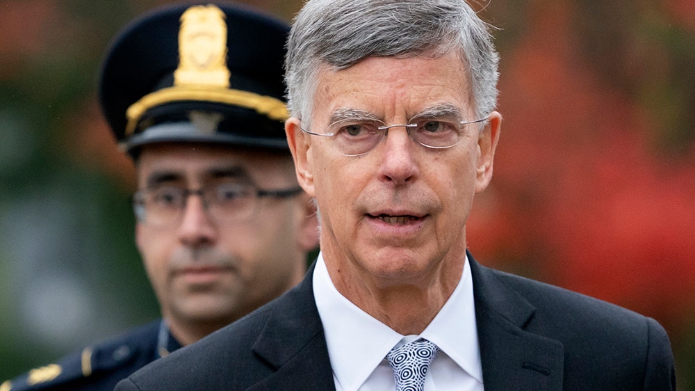 Ambassador William Taylor is escorted by US Capitol Police as he arrives to testify before House committees as part of the Democrats’ impeachment investigation of President Donald Trump
