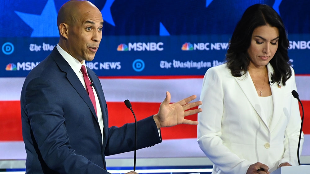 Democratic presidential hopefuls New Jersey Senator Cory Booker and Representative for Hawaii Tulsi Gabbard participate in the fifth Democratic primary debate