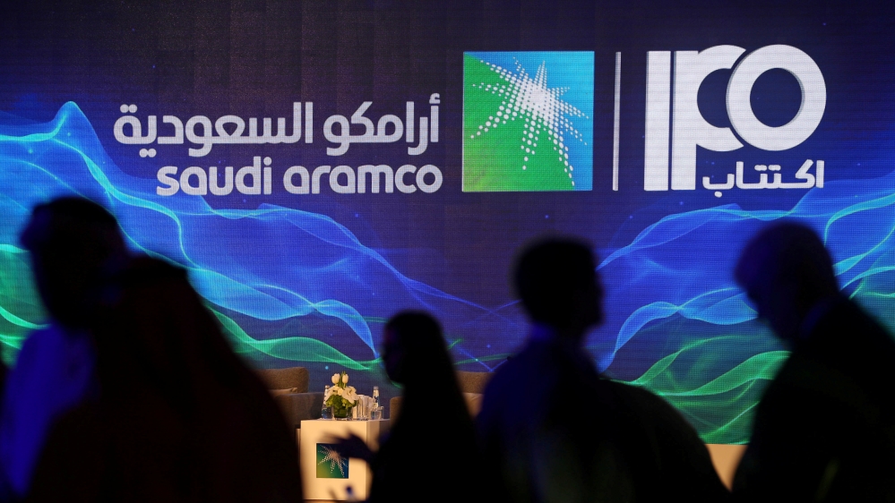 Sign of Saudi Aramco''s IPO is seen during a news conference by the state oil company in Dhahran