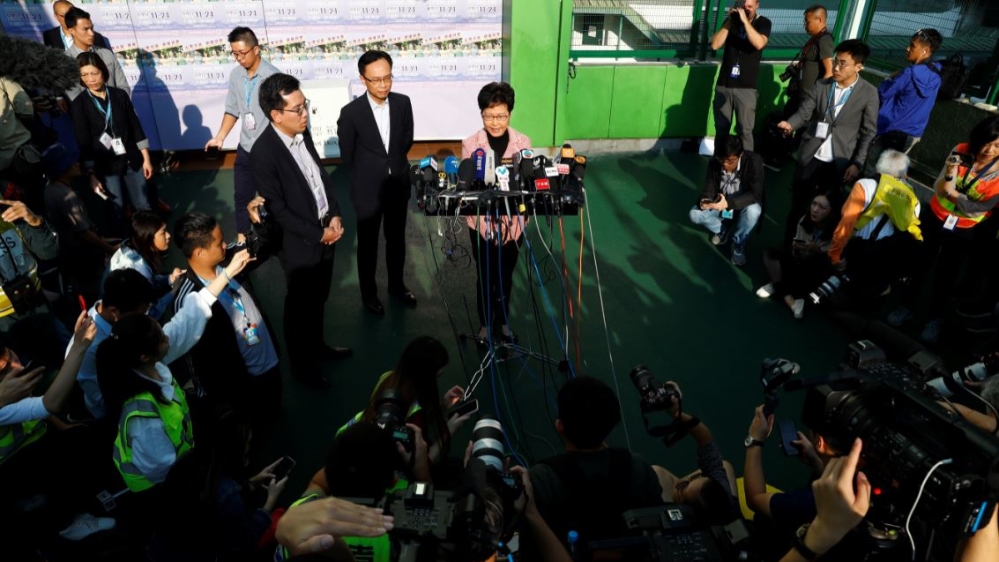 Hong Kong Chief Executive Carrie Lam speaks to the media after casting her vote at a polling station