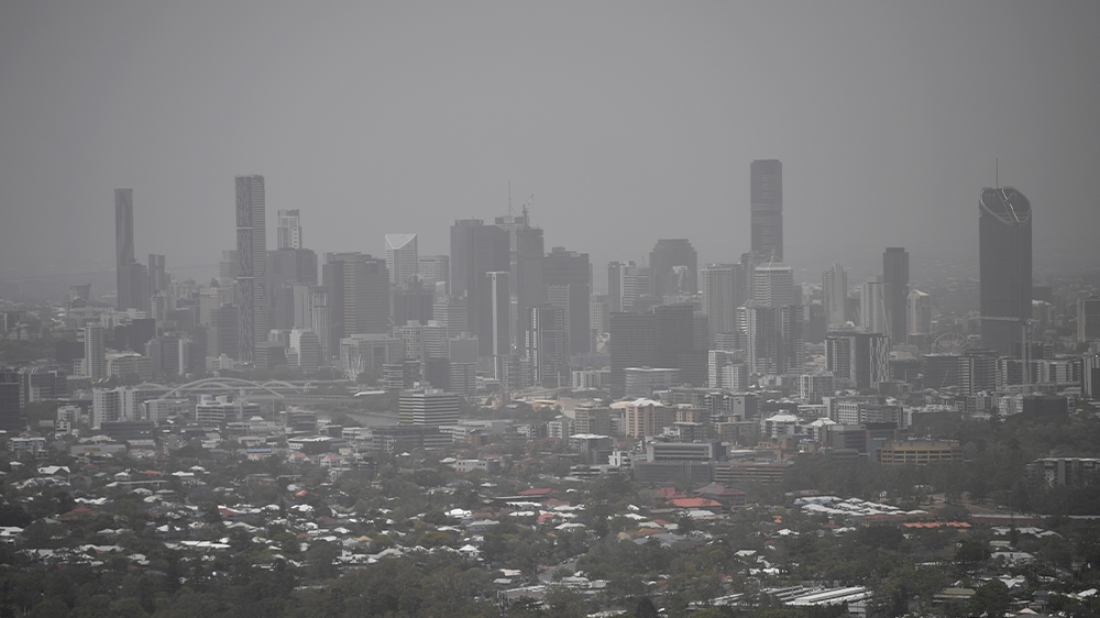 Brisbane has been shrouded in smoke haze as a result of the bushfires raging in the state. [Dan Peled, AAP Image via Reuters]