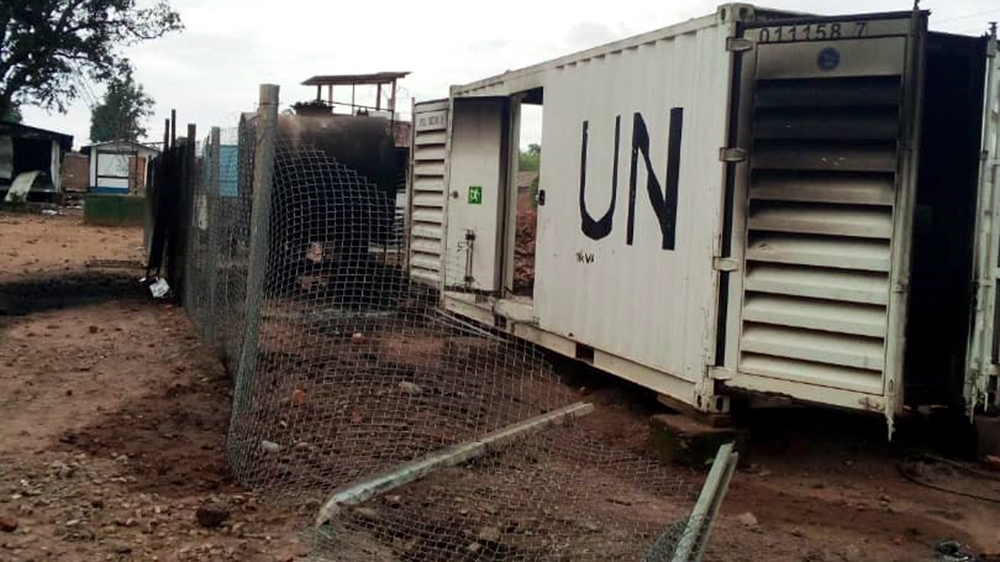 Burnt containers are seen at the United Nations (UN) civil base in Beni in the eastern part of the Democratic Republic of Congo on November 26, 2019. - On November 25, 2019 angry demonstrators ransack