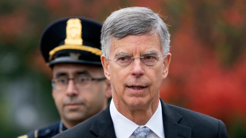 Taylor is escorted by US Capitol Police as he arrives to testify before House committees as part of the Democrats’ impeachment investigation of President Donald Trump