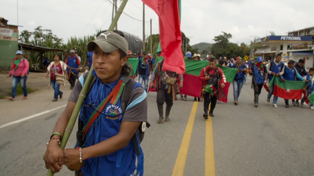 A procession of Indigenous Guardians march along the Pan-American Highway outside of Caldono, Cauca during the first day of Colombia’s national strike