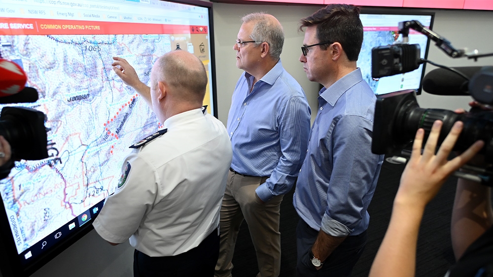 Prime Minister Scott Morrison, centre, visited the headquarters of the New South Wales (NSW) Rural Fire Service (RFS) after he cut short a much-criticised holiday to Hawaii that he had taken despite the bushfires ravaging Australia’s east