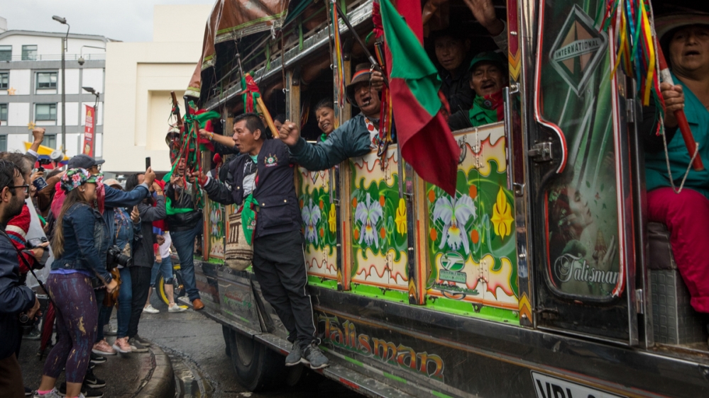 People in Bogota bid farewell to the Indigenous Guard as they leave on a caravan of chiva busses back to Cauca