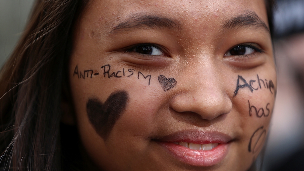 A protester takes part in a demonstration against racism in London, UK, March 18, 2017