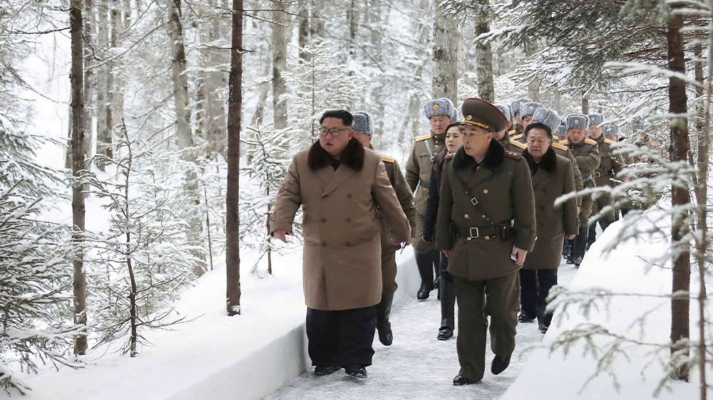 Kim Jong Un in pictures released in early December during a visit to battle areas of Mount Paektu