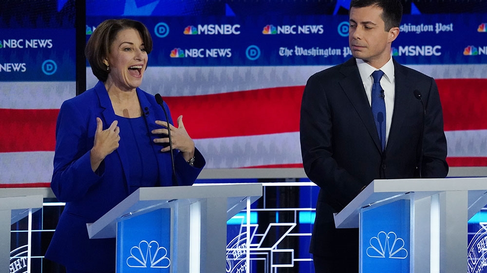 Democratic presidential candidate Senator Amy Klobuchar speaks as South Bend Mayor Pete Buttigieg listens during the fifth 2020 campaign debate at the Tyler Perry Studios in Atlanta, Georgia