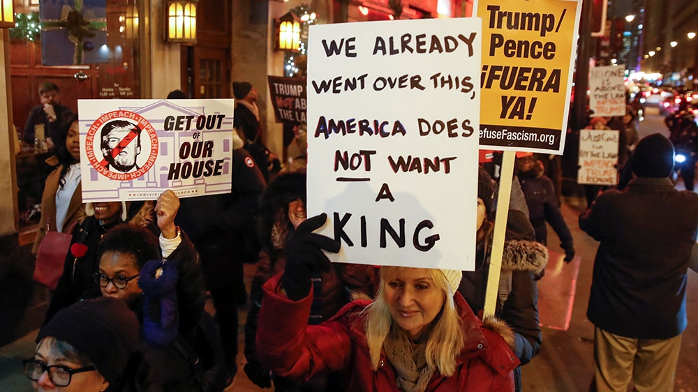 Protesters take part in a rally to support the impeachment and removal of Trump in Chicago, Illinois