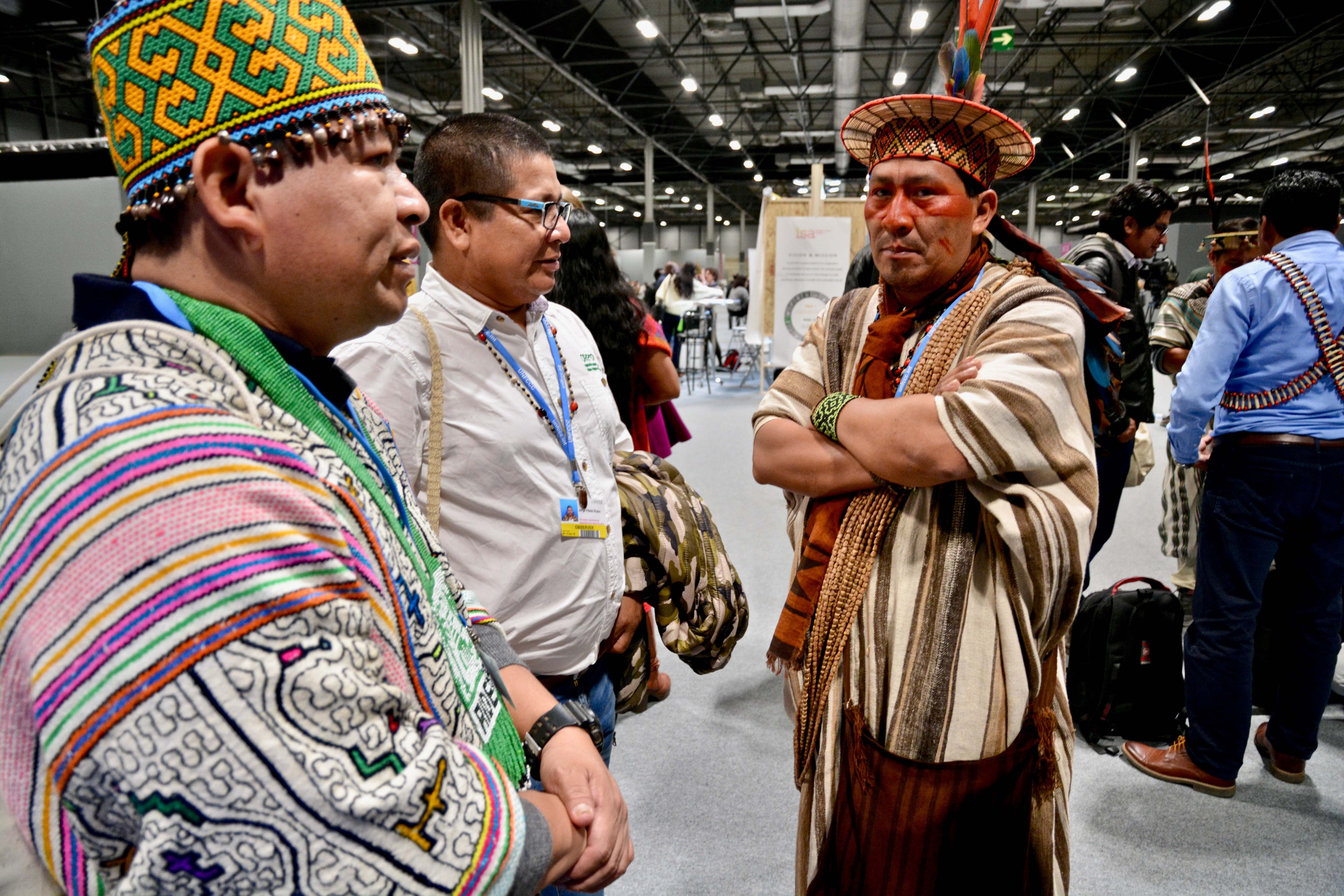 Representatives of indigenous communities in the Amazon wait patiently to talk to the Peruvian environment minister at COP25