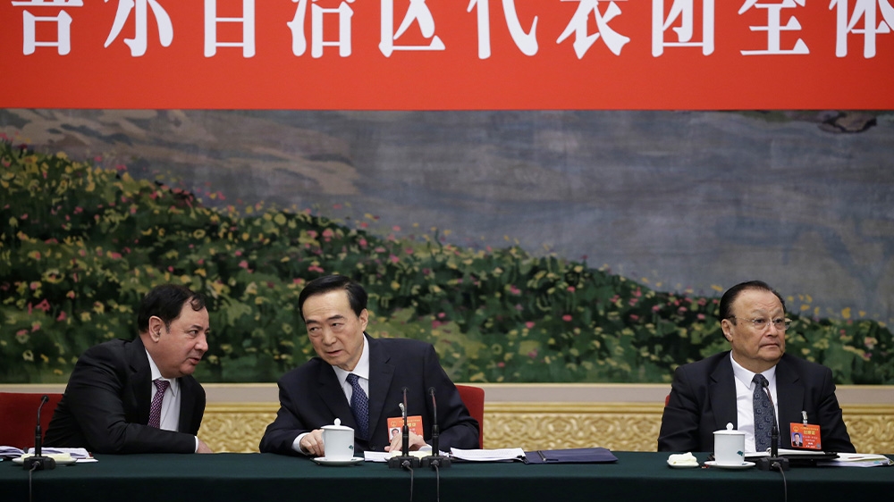 Communist Party Secretary of Xinjiang Chen Quanguo, centre, is named in the Uighur Act of 2019 and could be at risk of sanctions from the US