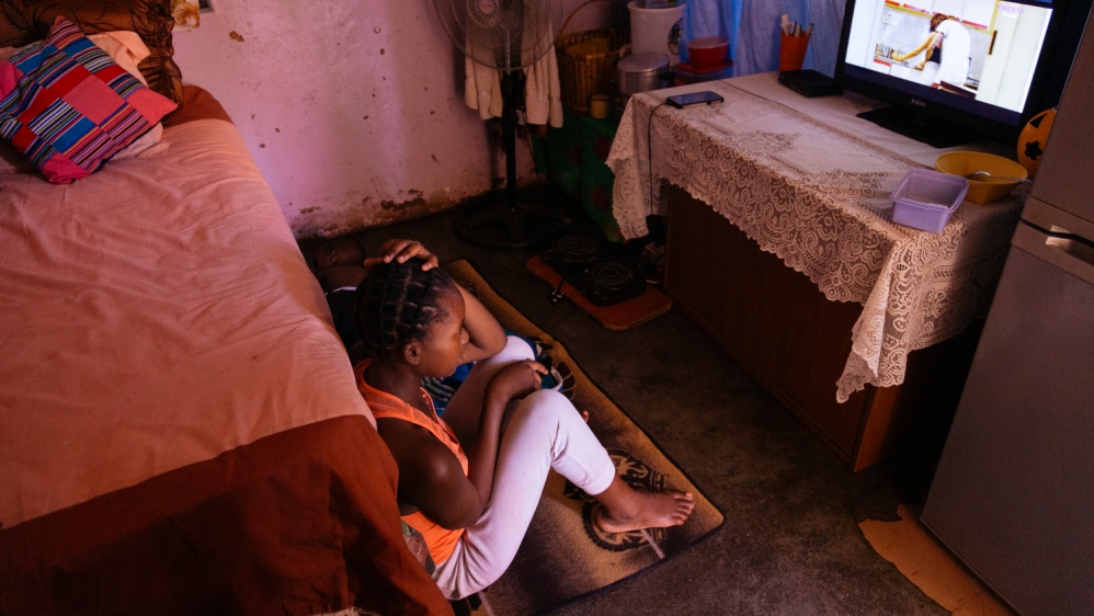 A 17-year-old resident of the children’s home, who is originally from Zimbabwe, sits with her one-year-old son, who was born in South Africa