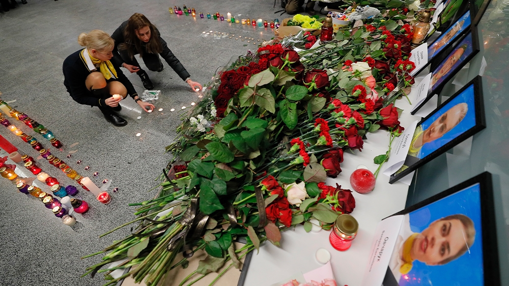 Relatives, colleagues, and friends pay their respects to the UIA crew who died when their plane crashed shortly after take off from Tehran on its way to Kyiv