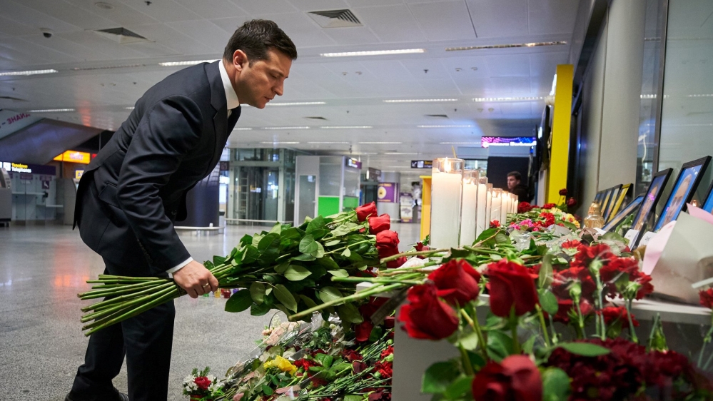 Ukrainian President Volodymyr Zelenskyy lays flowers to commemorate victims of the Ukraine International Airlines Boeing 737-800 plane crash, at a memorial in Boryspil International airport