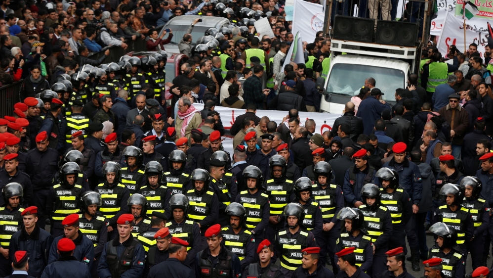 Jordanian police officers gather in Amman during a protest against the government’s agreement to import natural gas from Israel