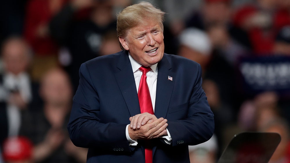 President Donald Trump reacts after speaking during a campaign rally in Toledo, Ohio
