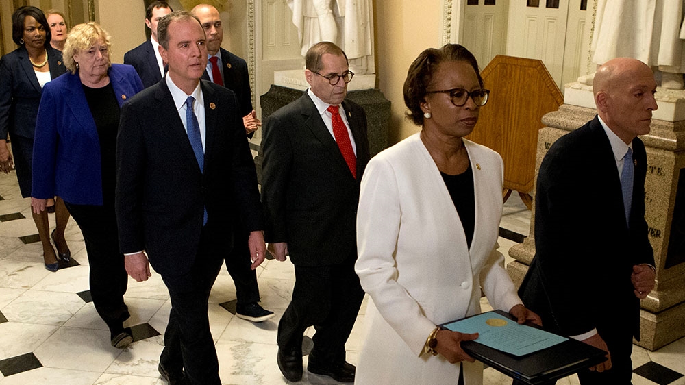 House Sergeant at Arms Paul Irving and Clerk of the House Cheryl Johnson deliver the Articles of Impeachment against President Donald Trump to Secretary of the Senate Julie Adams on Capitol Hill in Washington, January 15, 2020