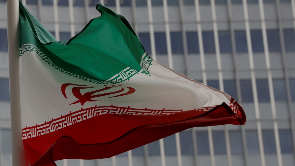 An Iranian flag flutters in front of the International Atomic Energy Agency (IAEA) headquarters in Vienna, Austria September 9, 2019. REUTERS/Leonhard Foeger/File Photo