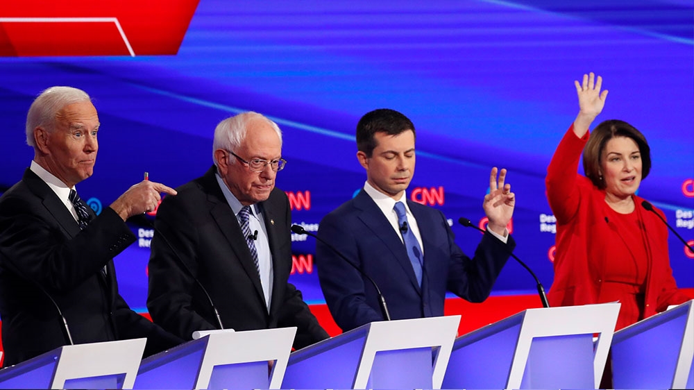 Democratic 2020 US presidential candidates former Vice President Joe Biden, Senator Bernie Sanders, former South Bend Mayor Pete Buttigieg and Senator Amy Klobuchar participate in the seventh Democratic 2020 presidential debate in Des Moines, Iowa