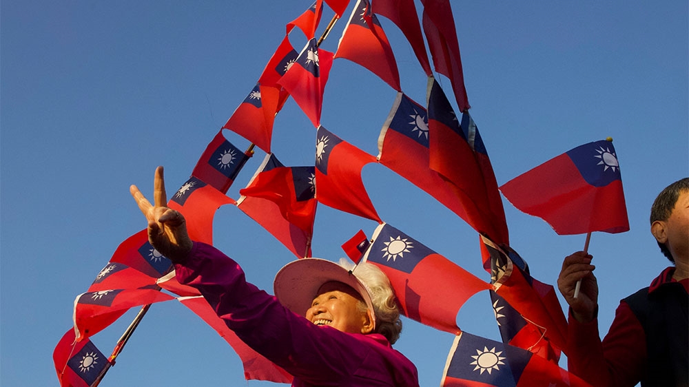 Supporters of Han Kuo-yu, the pro-China KMT’s election candidate; academics say Taiwan’s clear political identities help feed the spread of disinformation
