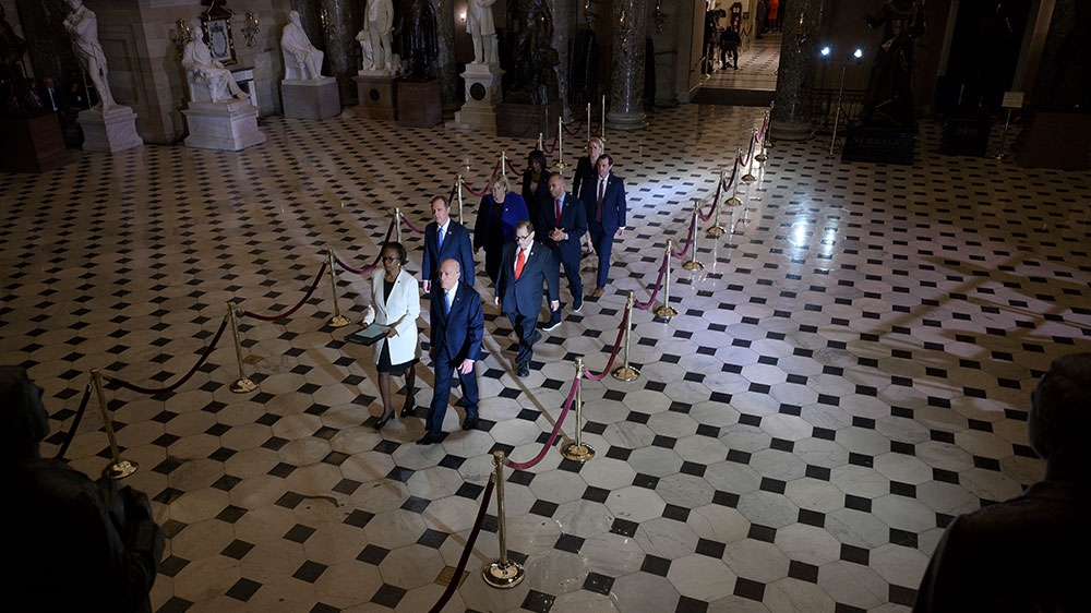 House Managers walk to the US Senate to deliver the Articles of Impeachment against US President Donald Trump on Capitol Hill