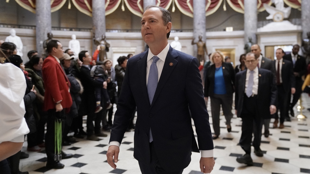Impeachment manager walk to a press conference at the Capitol