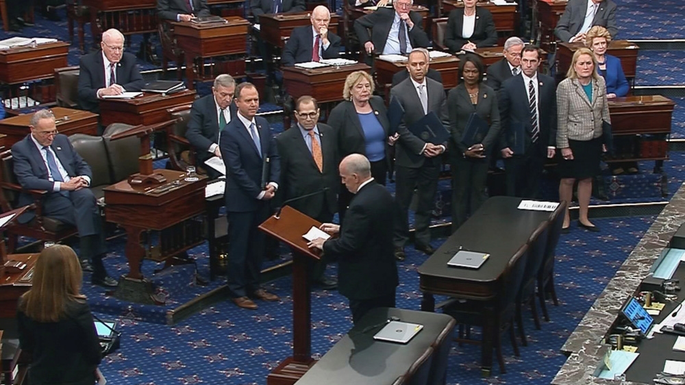 The US Senate Sergeant at Arms Michael Stenger introduces the US House impeachment managers, including lead manager House Intelligence Committee Chairman Adam Schiff, on the floor of the Senate as they arrive for the procedural start of the Senate impeachment trial