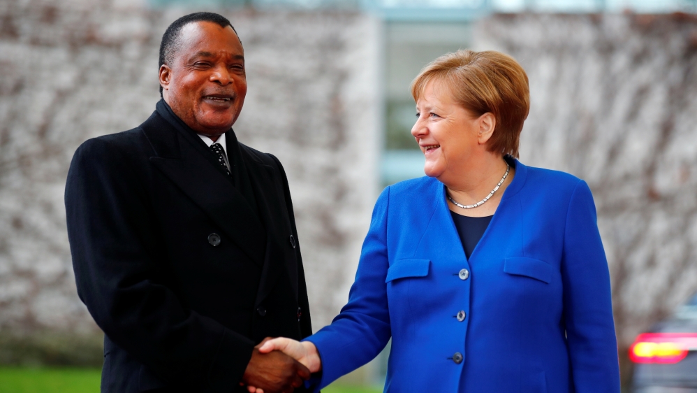 German Chancellor Angela Merkel welcomes Republic of the Congo’s President Denis Sassou Nguesso at the beginning of the Libya summit in Berlin