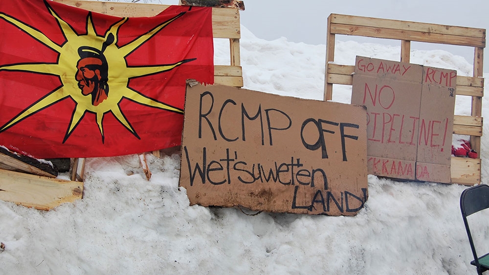 Signs from Kahnawake, a Mohawk First Nation, where people have set up a blockade