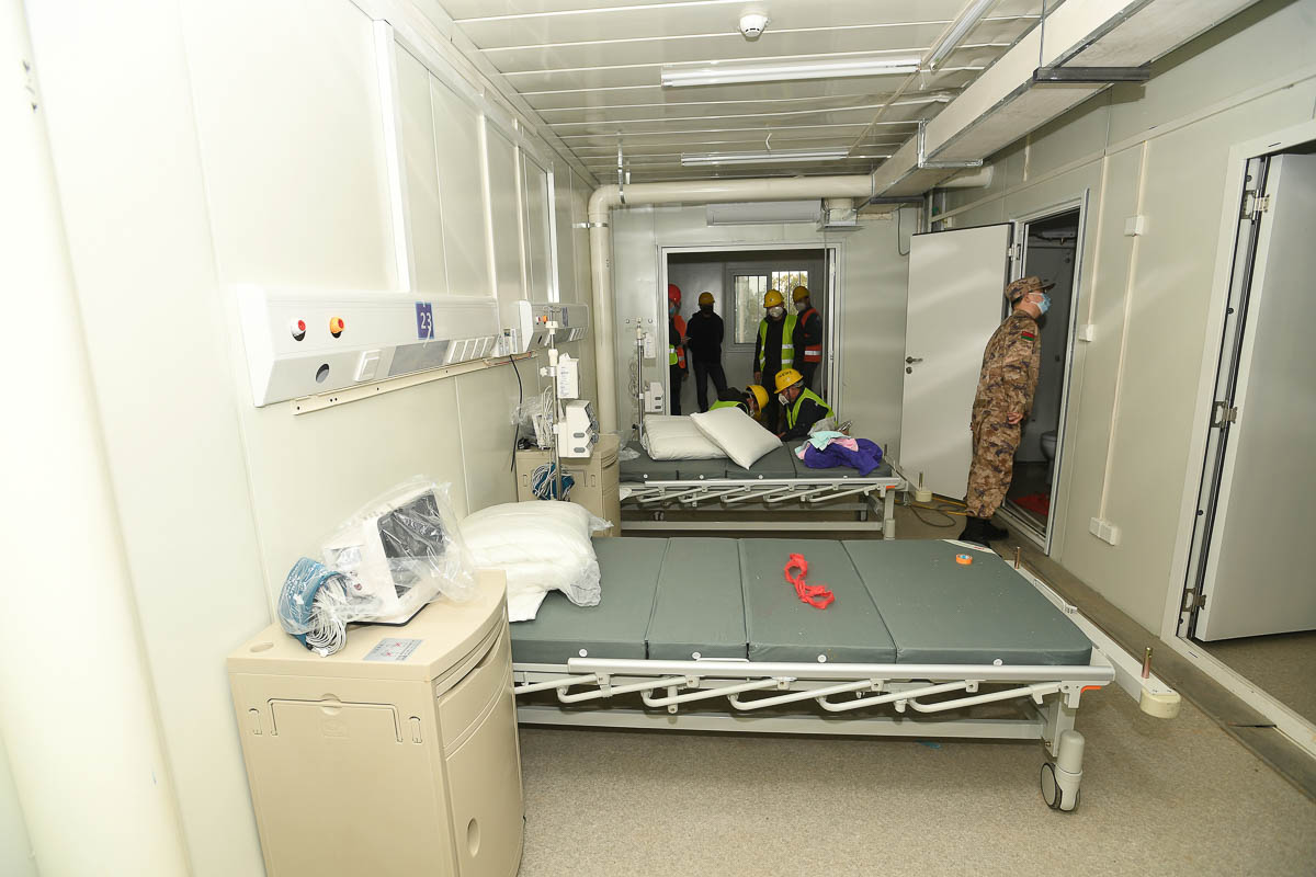 An army medic looks around a room in Huoshenshan Hospital in Wuhan, Hubei Province, China, 02 February 2020. The construction of the 1,000-bed temporary field hospital, which began on 24 January 2020