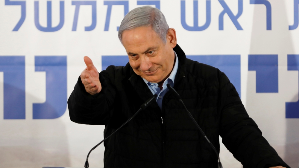 Israeli Prime Minister Benjamin Netanyahu gestures as he speaks during an event marking Tu BiShvat, the Jewish Arbor Day, in the Israeli settlement of Mevo''ot Yericho, in the occupied West Bank