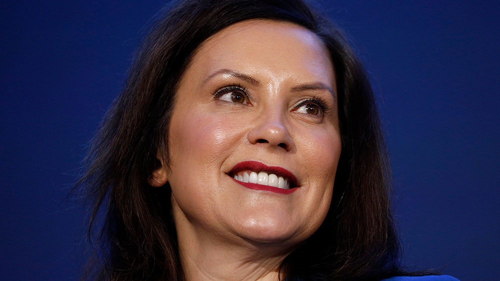 Michigan Governor Gretchen Whitmer stands on stage at an event in Hamtramck, Michigan