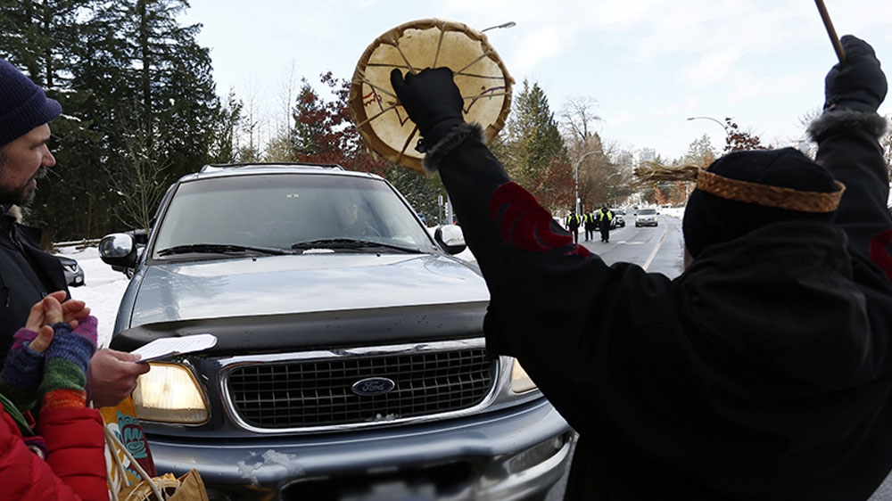 Supporters of the Wet’suwet’en nation protest by blocking a road outside the provincial headquarters of the RCMP in Surrey, BC