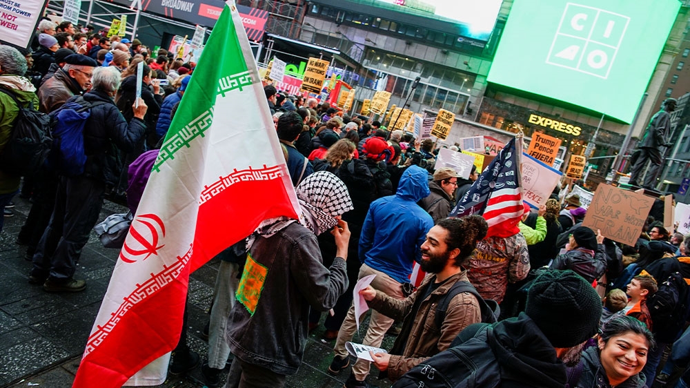 People take part in an anti-war protest amid increased tensions between the United States and Iran in Times Square in New York, US