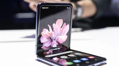 The Galaxy Z Flip smartphone is displayed during the Samsung Unpacked product launch event in San Francisco