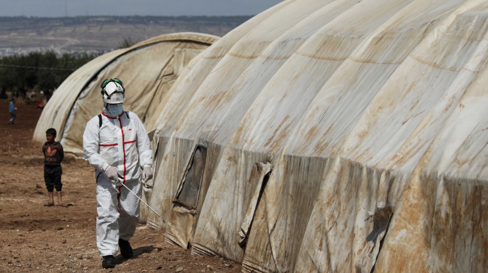 Syrian Civil Defence sanitising a tent at the Bab al-Nour internally displaced persons camp in Azaz, Syria