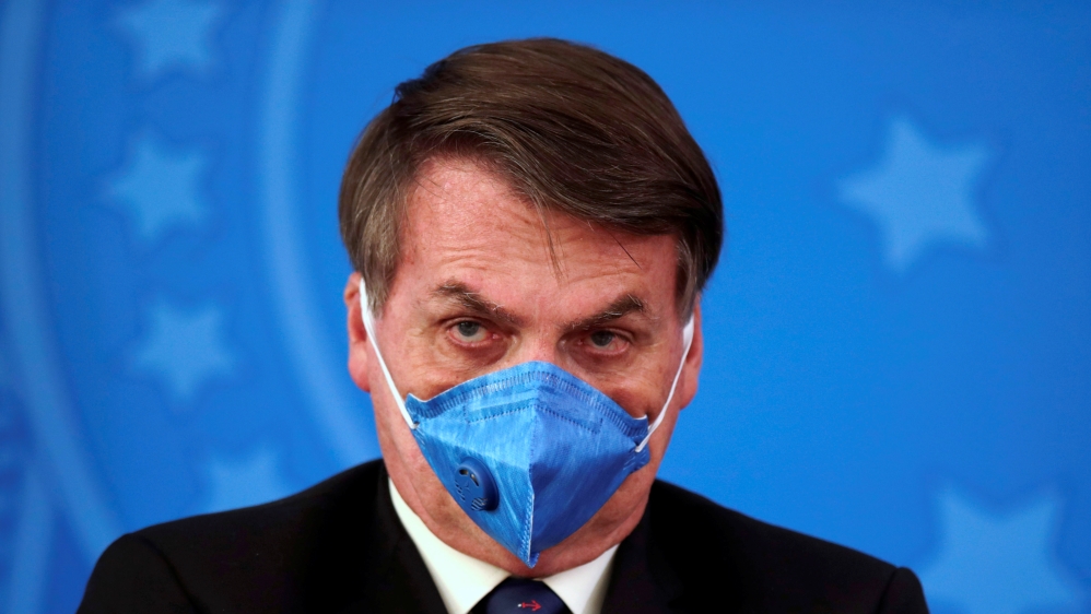 Brazil''s President Jair Bolsonaro is pictured with his protective face mask at a press statement during the coronavirus disease (COVID-19) outbreak in Brasilia