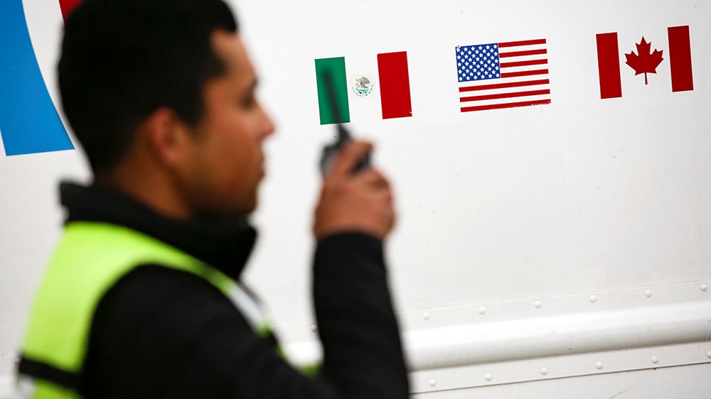 The flags of Mexico, the United States and Canada are pictured at a security booth at Zaragoza-Ysleta border crossing bridge, in Ciudad Juarez, Mexico