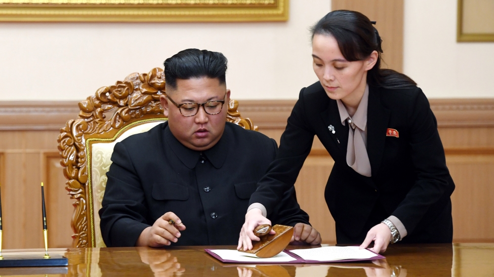 Kim Yo Jong helps her brother sign a joint statement following the summit with South Korean President Moon Jae-in at the Paekhwawon State Guesthouse in Pyongyang, North Korea, on September 19, 2018