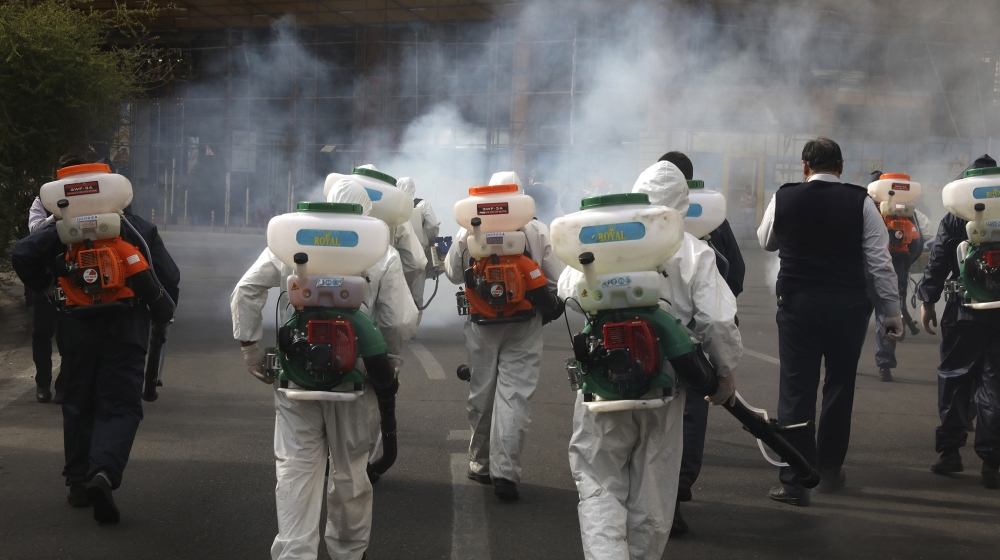 irefighters disinfect a square against the new coronavirus, in western Tehran, Iran, Friday, March 13, 2020. The new coronavirus outbreak has reached Iran''s top officials, with its senior vice preside