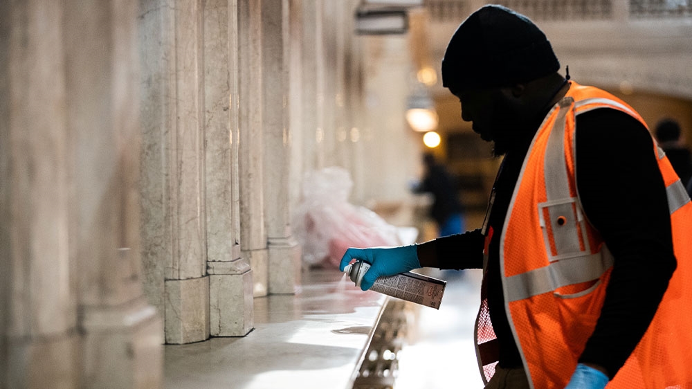 A Metropolitan Transportation Authority (MTA) workers cleaning a station at the lobby of Grand Central Station during the outbreak of the coronavirus disease, COVID-19, in New York City, US