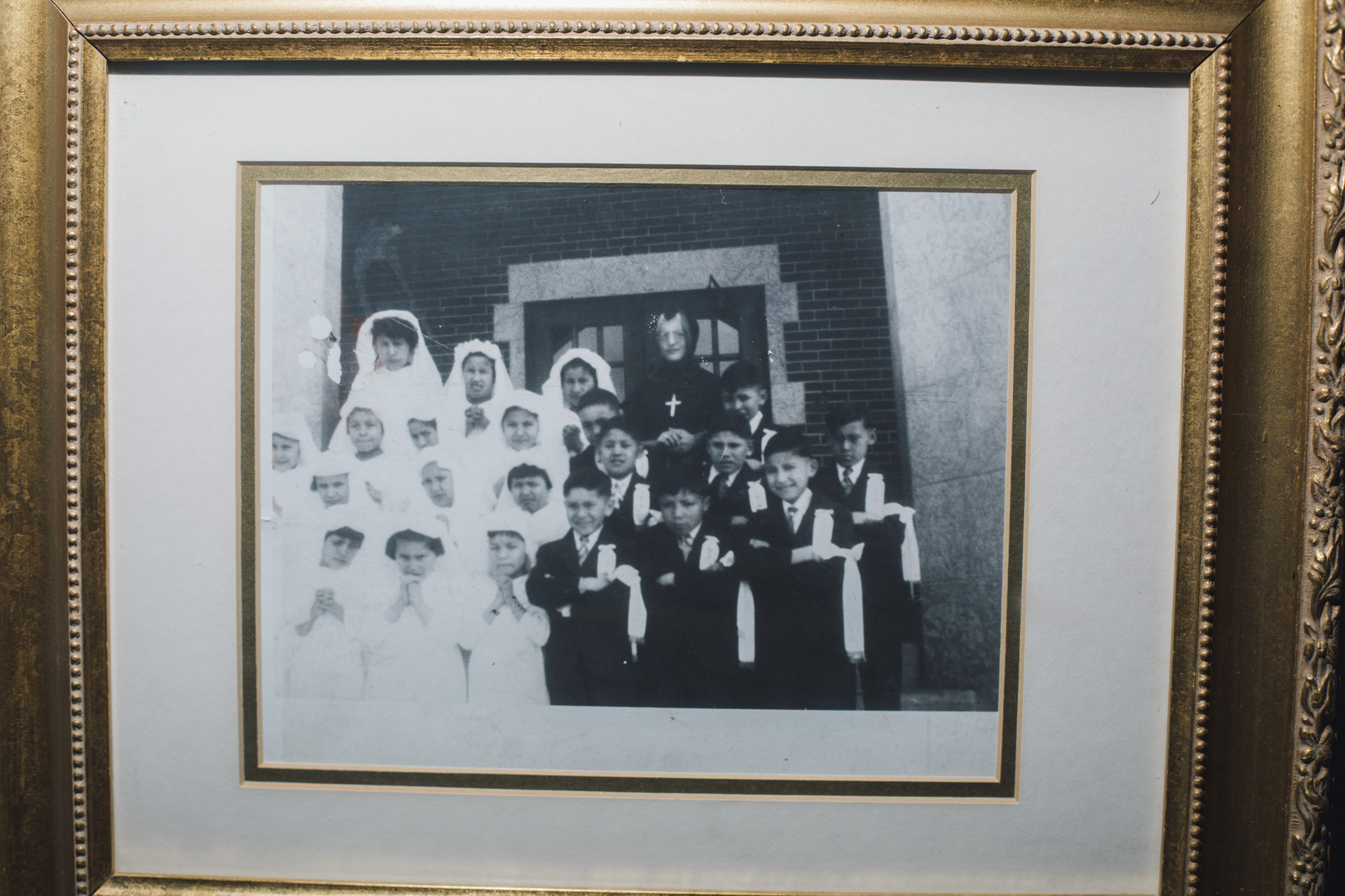 A museum display shows residential school students in Saddle Lake, Alberta